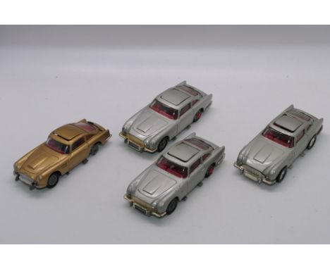Corgi - James Bond - 4 x unboxed Aston Martin DB5 models, a Goldfinger car # 261, two silver # 270 cars and a later # 270 wit