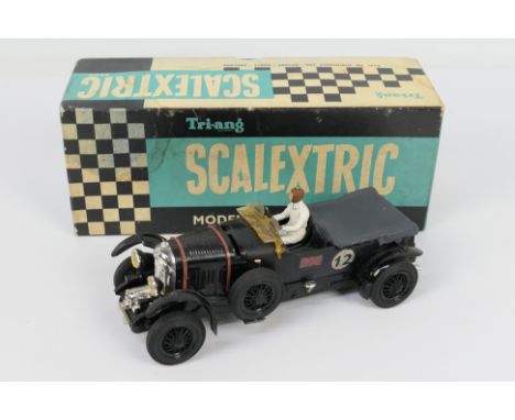 Scalextric - A boxed Vintage Bentley 4 1/2 Litre Super Charged in black # MM/C64. The model appears in Very Good condition wi