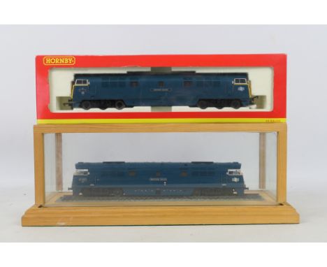 OO Gauge - Hornby Railways. A selection of Two diesel locomotives, one boxed, one in a wood / glass display box. Lot consists