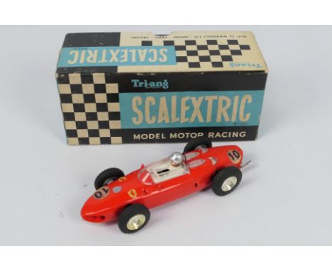 Scalextric - A boxed vintage Ferrari # MM/C62. The model appears in Very Good condition with some signs of ageing to the stic
