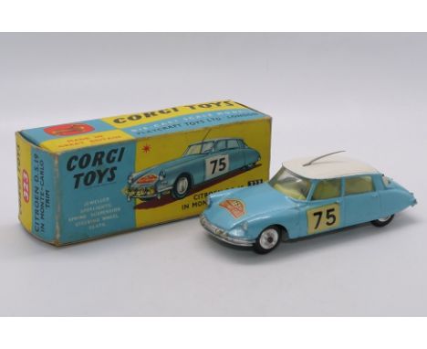 Corgi - A boxed Citroen DS in Monte Carlo Rally Trim # 323. The car appears in Very Good condition with only light signs of p