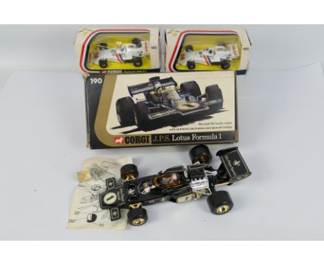 Corgi - 3 x boxed Formula 1 cars, a Lotus in JPS livery in 1:18 scale # 190 and 2 x Hesketh 308 in 1:36 scale # 160. The cars