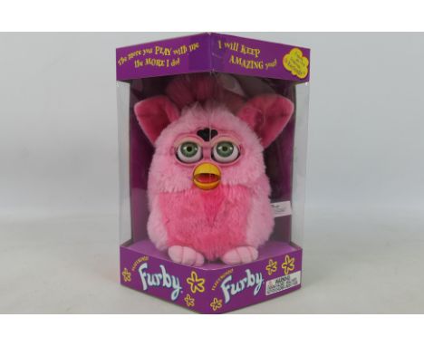 Hasbro - Tiger Electronics -  A boxed model #70-800 Generation 3 1998 Pink Flamingo' Electronic Furby by Hasbro. The Furby wi