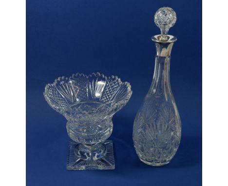 A cut glass decanter with silver collar and a cut glass bowl on pedestal foot 