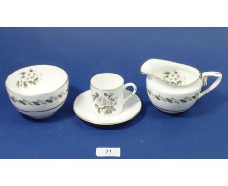 A Royal Worcester 'Bernina' coffee set comprising: fifteen cups and eighteen saucers, milk and sugar 