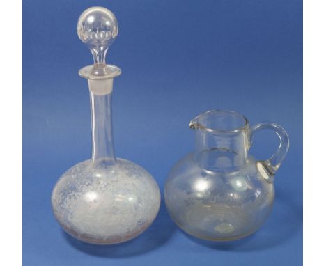 A Georgian glass jug with etched decoration and an etched decanter 