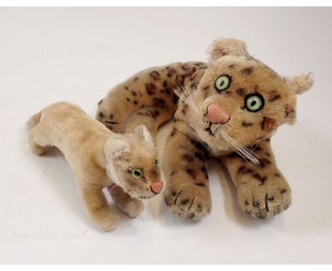 A Steiff leopard (ear detached no button) and lion cub 