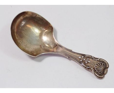 A Victorian silver caddy spoon with embossed shell terminal by George Unite, Birmingham 1840 