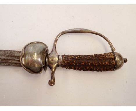 A fine 18th century hunting sword, the stag horn handle with silver mounts and indistinct stamped hallmarks, in canvas scabba