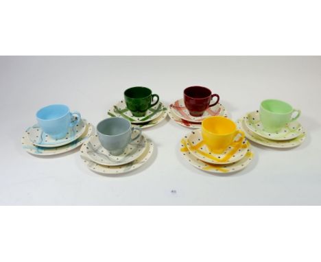 A set of six vintage harlequin tea cups and spotted saucers plus side plates 