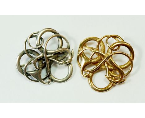 A 9 carat gold brooch and matching silver Celtic stylised dragon design one, 3.5cm diameter, gold weight 9g