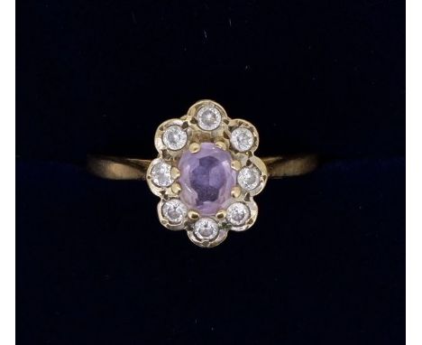 A 9 carat gold amethyst and paste costume ring, size N 