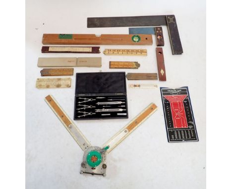 A collection of draftsman tools including a Halifax Simplon Rabone and Higgins folding ruler, compass set etc. 