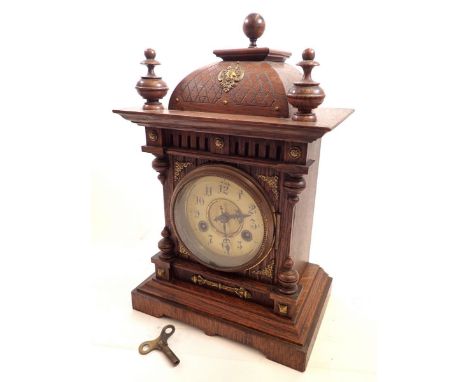 A Victorian carved oak mantel clock, 35cm tall 