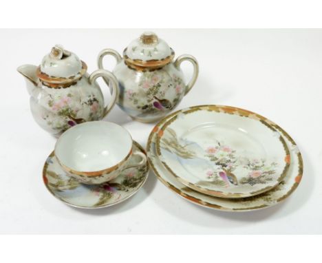 A Japanese eggshell tea service comprising : nine cups, ten saucers one a/f, eight tea plates, two larger plates, one teapot 