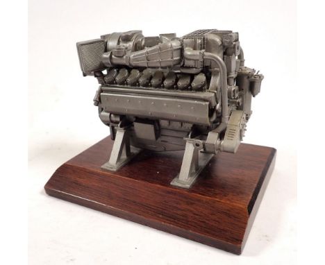 A miniature model V16 Diesel engine on plinth, 12.5cm wide 