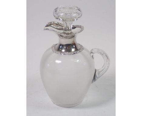 A glass claret decanter with silver spout and collar, 21cm tall, London 1913, William Comyns &amp; Sons 