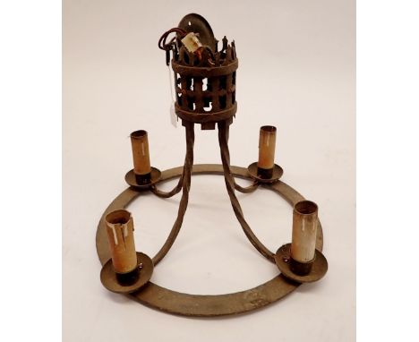 A medieval style cast iron circular light fitting, 39.5cm diameter