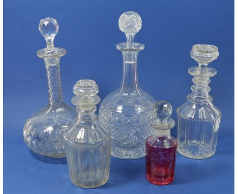 Four various decanters and a red flashed liqueur decanter, tallest 30cm