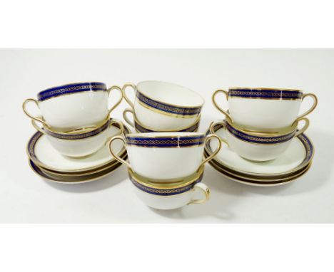 A set of Copeland Spode blue and gilt rimed chocolate cups and saucers R3204 and two tea cups (2 a/f) 