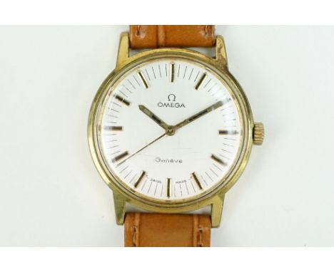 Omega Geneve wrist watch having a silvered face with baton markers to the chapter ring white black enamel to the markers and 