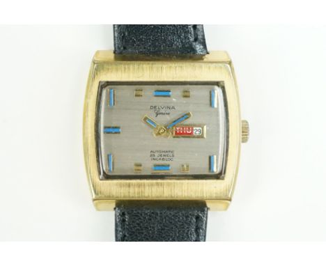 Vintage Delvina Geneve automatic wrist watch having a rectangular face with gilt baton marker to the chapter ring, with day a