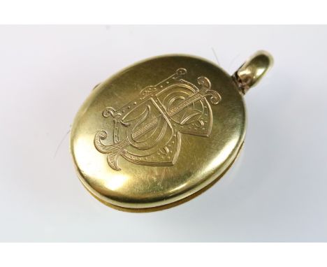 Early 20th Century Edwardian 18ct gold, emerald and enamel mourning locket. The locket being set with a square step cut emera