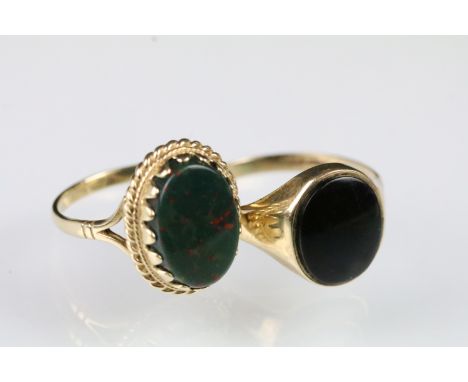 Two 9ct gold stone set panel rings to include a bloodstone panel ring (hallmarked Sheffield, size O.5) and an onyx panel ring