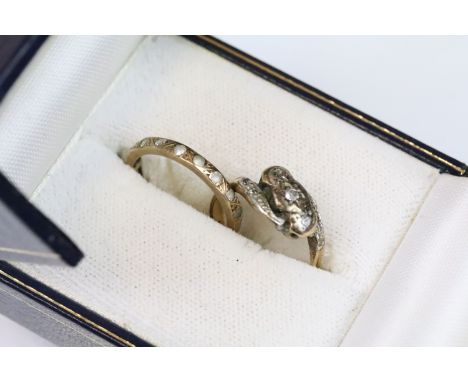 9ct gold and diamond cross over ring together with a white stone eternity ring. The cross over ring set with round cut diamon