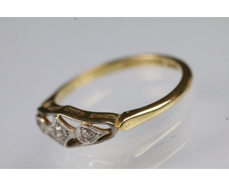 Art Deco 18ct gold and diamond ring having a pierced panel head set with three round cut diamonds. Marked 18ct. Size M. 