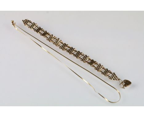 9ct gold hallmarked gate link bracelet with heart padlock (hallmarked London 1985) together with a 9ct gold flat link necklac