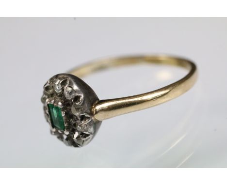 19th Century Victorian emerald and diamond halo ring. The ring being set with a step cut emerald to centre with a halo of old