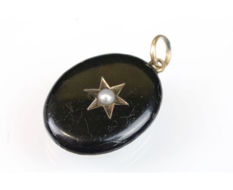 19th Century Victorian pearl and black enamel mourning locket. The locket of oval form with a star to centre set with a half 