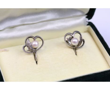 Pair of vintage Mikimoto silver and cultured pearl screw back earrings set with cultured pearls to the centre set within foli