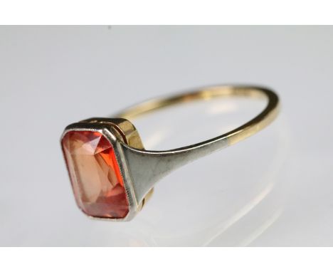 Art Deco 18ct gold and orange topaz ring being set with an rectangular mixed cut orange topaz in a bezel setting with plain b