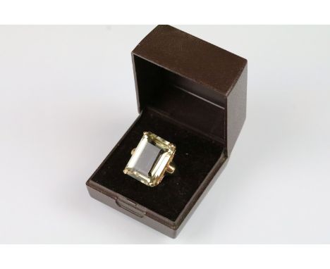 9ct gold and quartz dress ring being set with a rectangular step cut quartz within a 9ct gold mount. Shank marked 9ct. Size M