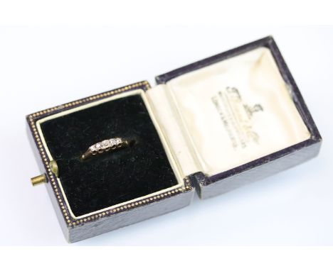 19th Century Victorian 15ct gold and diamond ring. The ring set with five old cut diamonds to a plain shank. Marked 15ct. Siz