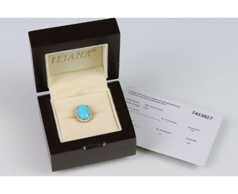 18ct gold turquoise and diamond halo ring. The ring being set with an oval turquoise panel to centre with a halo of round cut
