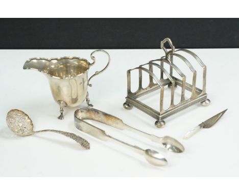 Group of silver items to include an toast rack (hallmarked Birmingham 1936), Adie Brothers small jug with moulded rim (Birmin