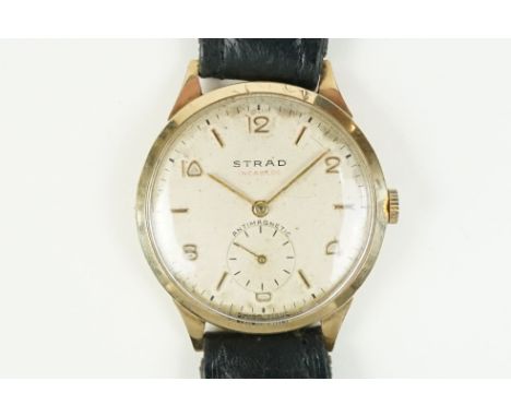 Vintage 9ct gold Strad incabloc wrist watch having a round face with arabic and baton markers to the chapter ring. Case hallm