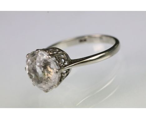 Vintage 18ct gold and white sapphire solitaire ring being set with a large round brilliant cut white sapphire within a pierce