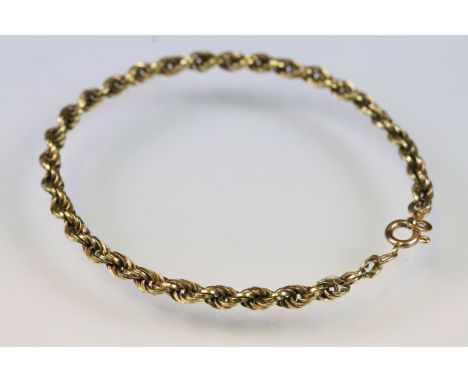 14ct gold rope twist chain bracelet with a spring ring clasp. Marked 585. Measures 7 inches. 