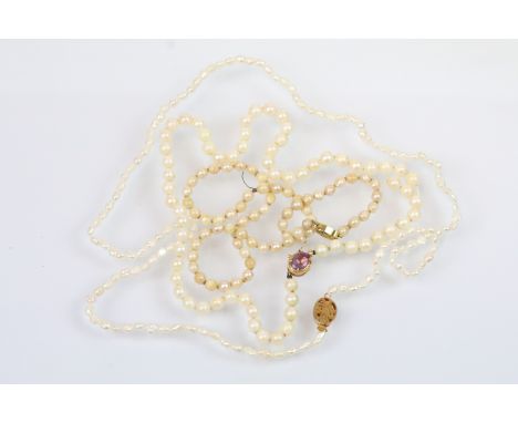 Three vintage pearl necklaces with gold clasps to include a 14ct clasp set with amethyst (necklace AF), necklace with oval cl