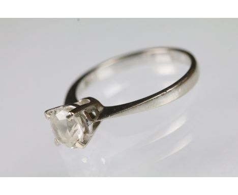 18ct white gold and white stone solitaire ring. The ring being set with a round brilliant cut white stone to a plain white go