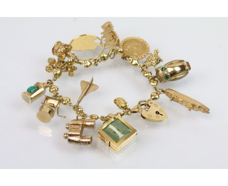 Vintage gold charm bracelet having a fancy heart link bracelet with 9ct gold fourteen charms (all hallmarked). Heart padlock 