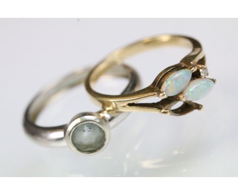 Two gold rings to include a 14ct gold and opal ring set with to marquise opal cabochons (one missing, size J, marked 14ct) an
