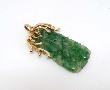 A jade pendant with 14ct gold mount. Approx 2” long   CONDITION: Please Note -  we do not make reference to the condition of 