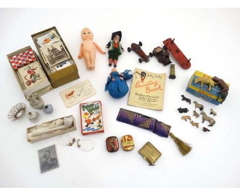 A box containing assorted vintage toys to include die cast and wooden farm animals, die cast carsa ''Jolly Golly painting boo