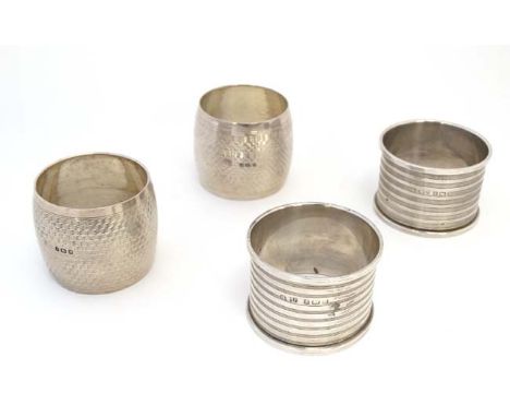 A pair of Art Deco napkin rings with engine turned decoration hallmarked  Birmingham 1946 maker Henry Williamson Ltd, togethe