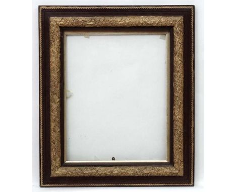 Picture Frame :An ornate late 19thC picture frame having a gilt slip and glass, decorated in brown lacquer and gilt ropetwist